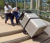 Moving cement trash containers